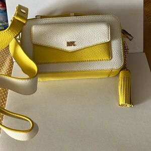 Michael Kors yellow and white camera style bag.